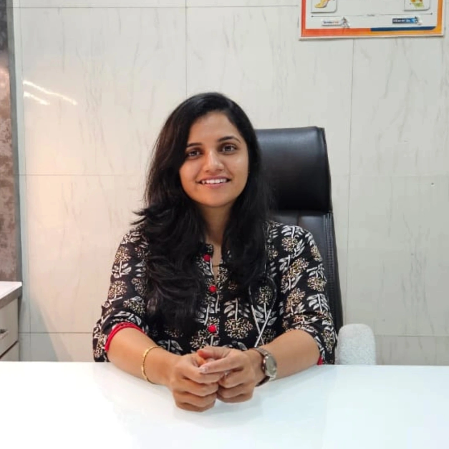 Dr. Snehal S. Dhumal, Homeopathic Doctor, at her clinic in Ichalkaranji